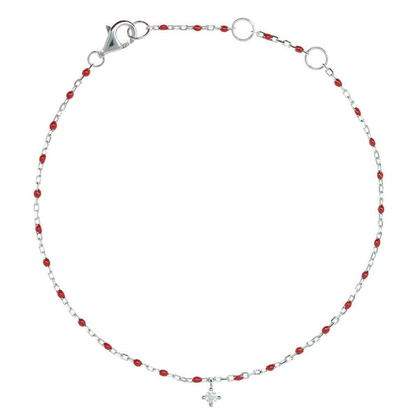 Sterling silver chain bracelet with red beads and a hanging CZ charm.