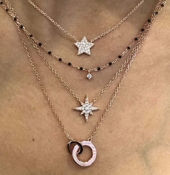 Elegant rose gold plated silver necklace with black beads and central sparkling Cubic Zirconia.