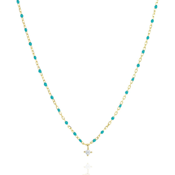 Gold-plated short chain and turquoise bead necklace with a central Cubic Zirconia stone.