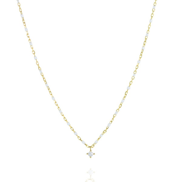 Elegant gold plated silver chain necklace with white beads and a central small cubic zirconia.