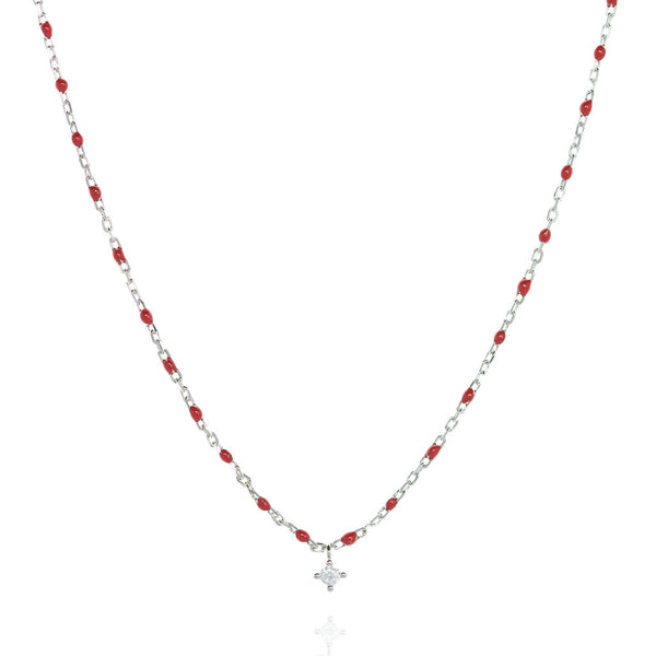 Sterling silver short chain necklace with red beads and a central small Cubic Zirconia.