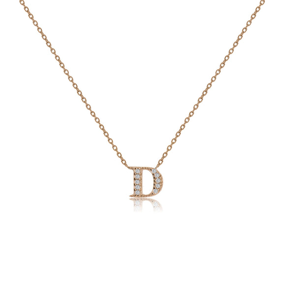 Rose gold plated initial necklace with cubic zirconia on adjustable chain.