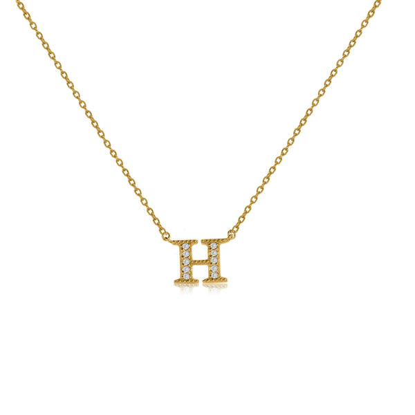 Gold plated initial necklace with CZ decoration and adjustable chain length.