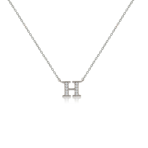 Sterling silver initial necklace with cubic zirconia decoration on an adjustable chain.
