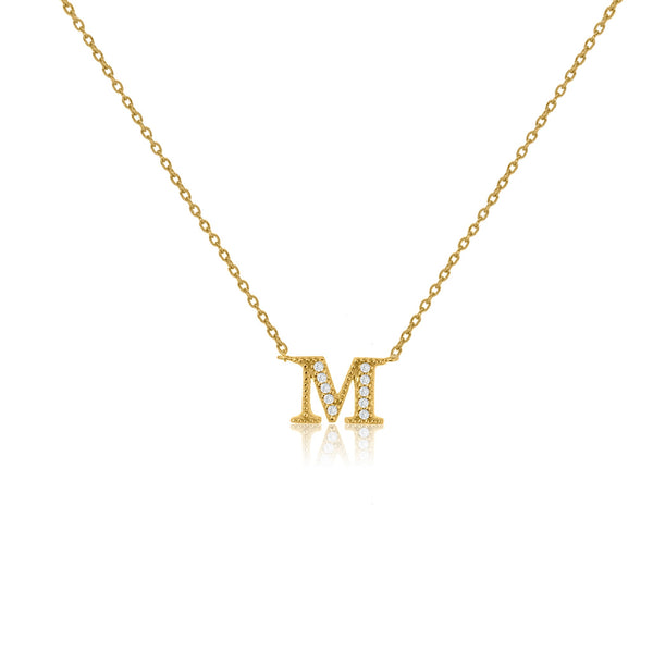Gold plated on silver initial necklace with CZ decoration, featuring an M pendant and a sliding length adjuster.