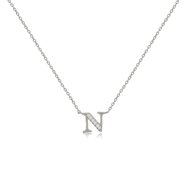 Sterling silver initial necklace featuring an 'N' pendant decorated with cubic zirconia stones on an adjustable chain.