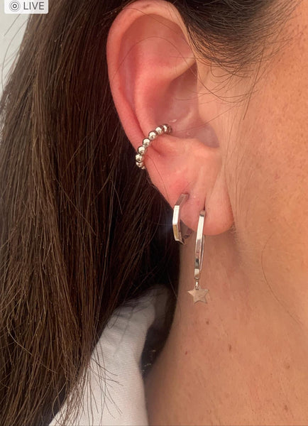 Sterling silver ellipse shaped hoop earrings with dangling star