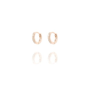 
Rose gold plated very small huggies with cubic zirconia set .

