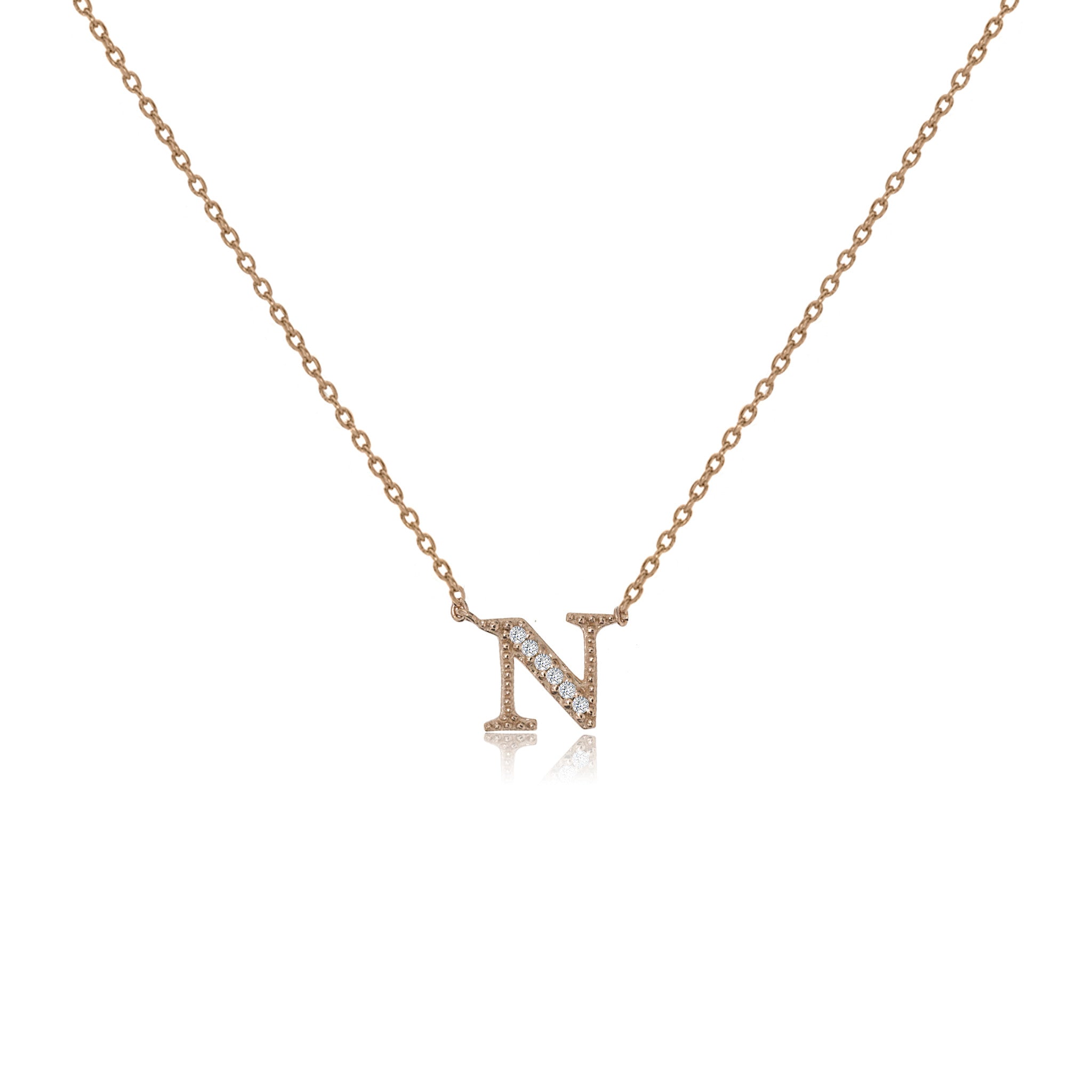 
Rose gold plated initial 'N' necklace with cubic zirconia decoration  .


